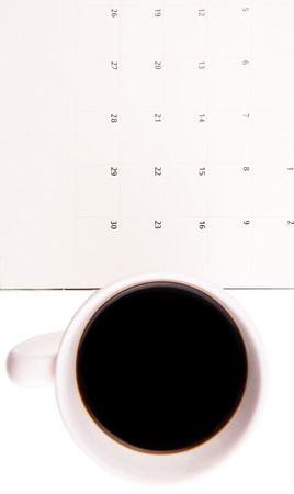 A mug of coffee and table day plannerの写真素材