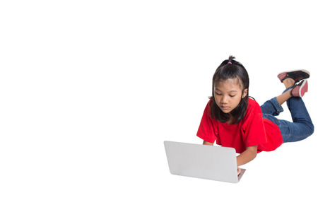 Young Asian girl with a laptop over white backgroundの写真素材