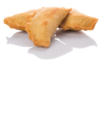 Popular traditional Malaysian snack curry puff over white background