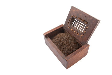 Dried, processed and blended tea leaves in wooden boxの写真素材