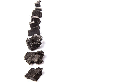 Lump of charcoal over white backgroundの写真素材