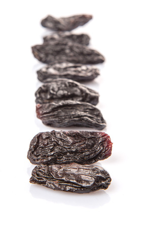 Black raisin over white backgroundの写真素材