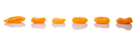 Dried apricot fruit over white backgroundの写真素材