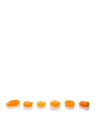 Dried apricot fruit over white backgroundの写真素材