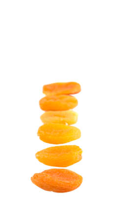 Dried apricot fruit over white backgroundの写真素材