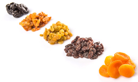 Mix dried fruit variety over white backgroundの写真素材