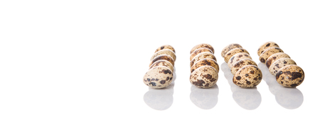 Quail eggs over white backgroundの写真素材