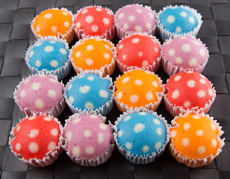 Popular Malaysian steamed rice polka dot muffin or apam polka dot on wicker backgroundの写真素材