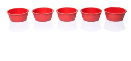 Red silicone muffin baking cup over white backgroundの写真素材