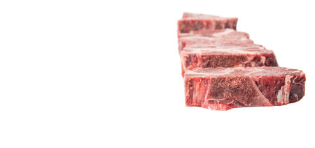 Chunk of cut frozen beef meat over white backgroundの写真素材