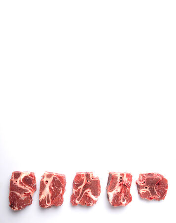 Chunk of cut frozen beef meat over white backgroundの写真素材