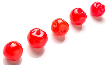 Pickled cherry fruit over white background
