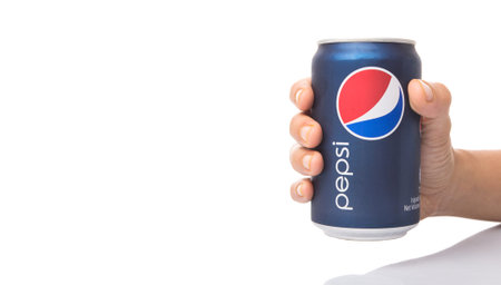 KUALA LUMPUR, MALAYSIA - JANUARY 12TH, 2015. Holding a can of Pepsi . Pepsi is a carbonated soft...