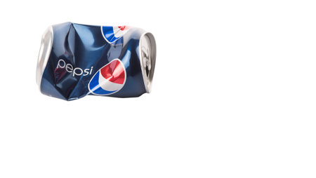 KUALA LUMPUR, MALAYSIA - JANUARY 13TH, 2015. Crumpled Pepsi can.