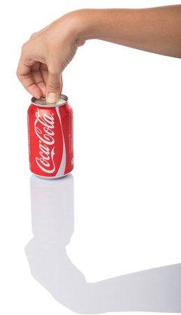 KUALA LUMPUR, MALAYSIA - JANUARY 6TH, 2015. Opening a can of Coca Colaのeditorial素材