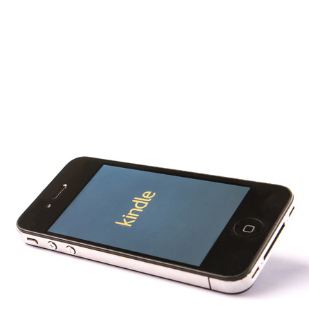 KUALA LUMPUR, MALAYSIA - JANUARY 17th 2015. Amazon Kindle apps for iPhone was released in 2010 and enable users to download, browse, and read e-books and other digital media via wireless networking.のeditorial素材