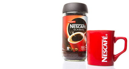 KUALA LUMPUR, MALAYSIA - JANUARY 17TH, 2015. Nescafe is a brand of instant powdered coffee made by Nestle S.A, a Swiss multinational food and beverage company, first introduced on April 1, 1938.のeditorial素材