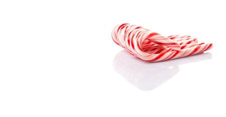 Mint Christmas colors candy cane over white backgroundの写真素材