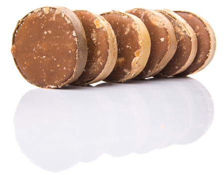 Round palm sugar over white backgroundの写真素材