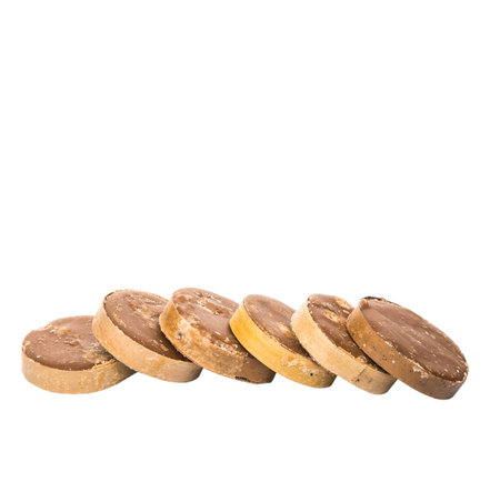 Round palm sugar over white background