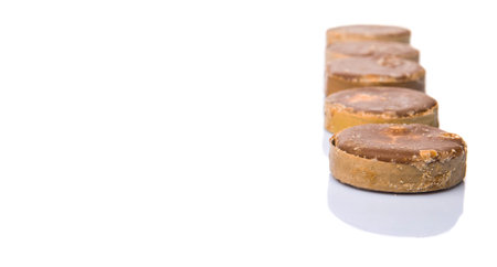 Round palm sugar over white backgroundの写真素材