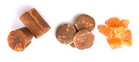 Palm sugar, coconut sugar and sugar cane rock  over white backgroundの写真素材