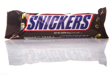 KUALA LUMPUR, MALAYSIA - JANUARY 21ST 2015. Introduced in 1930, Snickers chocolate bar is produced by Mars Incorporated and has an annual global sales of US $2 billion.のeditorial素材