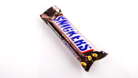 KUALA LUMPUR, MALAYSIA - JANUARY 21ST 2015. Introduced in 1930, Snickers chocolate bar is produced by Mars Incorporated and has an annual global sales of US $2 billion.のeditorial素材