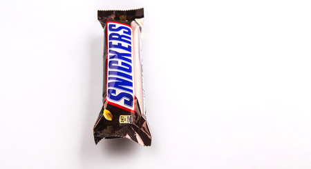KUALA LUMPUR, MALAYSIA - JANUARY 21ST 2015. Introduced in 1930, Snickers chocolate bar is produced by Mars Incorporated and has an annual global sales of US $2 billion.のeditorial素材