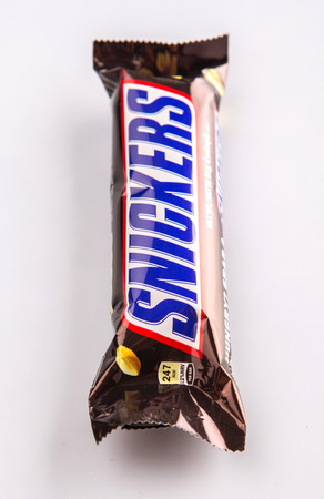 KUALA LUMPUR, MALAYSIA - JANUARY 21ST 2015. Introduced in 1930, Snickers chocolate bar is produced by Mars Incorporated and has an annual global sales of US $2 billion.のeditorial素材