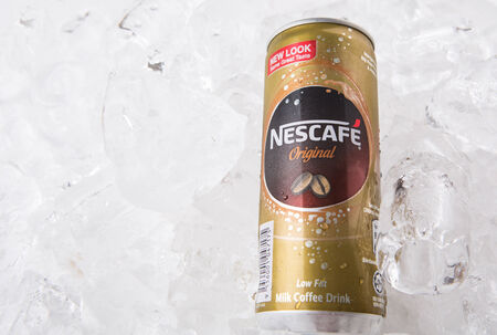 KUALA LUMPUR, MALAYSIA - FEBRUARY 13TH 2015. Nescafe can drink. Nescafe is a brand of instant coffee made by Nestle, a Swiss multinational food and beverage company, first introduced on April 1, 1938.のeditorial素材