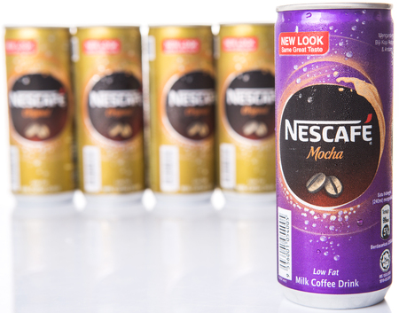 KUALA LUMPUR, MALAYSIA - FEBRUARY 13TH 2015. Nescafe can drinks. Nescafe is an instant coffee brand made by Nestle, a Swiss multinational food and beverage company, first introduced on April 1, 1938.のeditorial素材