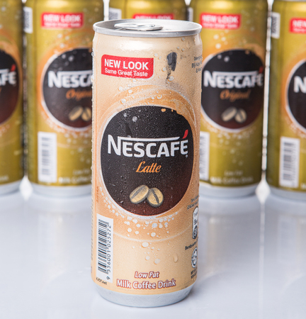 KUALA LUMPUR, MALAYSIA - FEBRUARY 13TH 2015. Nescafe can drinks. Nescafe is an instant coffee brand made by Nestle, a Swiss multinational food and beverage company, first introduced on April 1, 1938.のeditorial素材