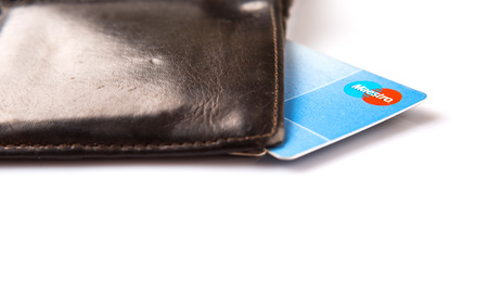 KUALA LUMPUR, MALAYSIA - FEBRUARY 19Th 2015. Maestro debit card in old wallet. Maestro is a multi-national debit card service owned by MasterCard Incorporated that was founded in 1992.のeditorial素材