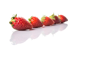 Strawberries over white backgroundの写真素材