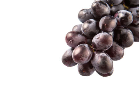 Black grapes over white backgroundの写真素材