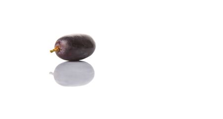 Black grapes over white backgroundの写真素材