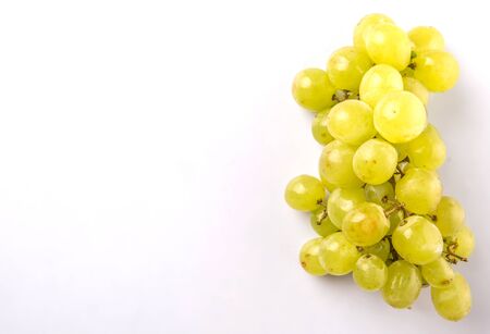 Green grapes fruit over white backgroundの写真素材