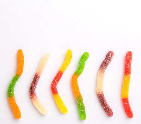 Colorful sugar jelly candy strip over white backgroundの写真素材