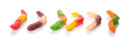 Colorful sugar jelly candy strip over white backgroundの写真素材