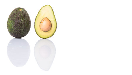 Avocado fruit over white background