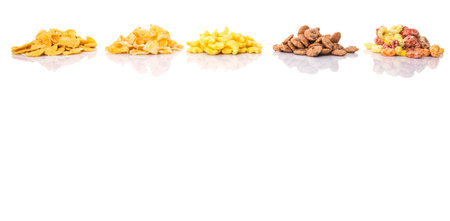 Mix variety of breakfast cereals over white backgroundの写真素材