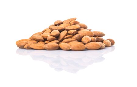 Raw almond nut over white backgroundの写真素材