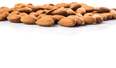 Raw almond nut over white backgroundの写真素材