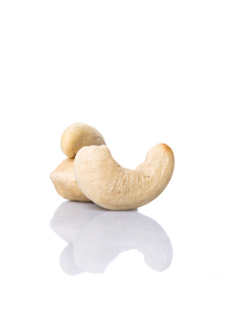 Raw cashew nuts over white backgroundの写真素材