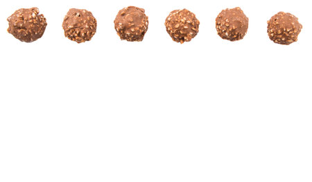 Chocolate balls with nuts over white backgroundの写真素材