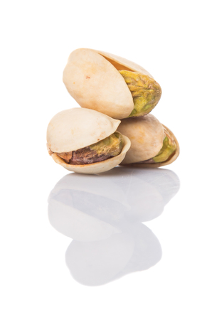Pistachio nuts over white backgroundの写真素材