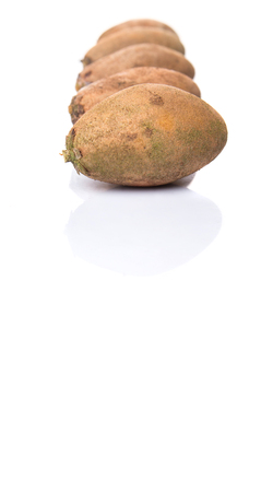 Sapodilla or Ciku fruit over white backgroundの写真素材