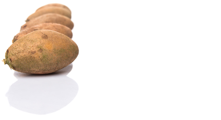 Sapodilla or Ciku fruit over white backgroundの写真素材