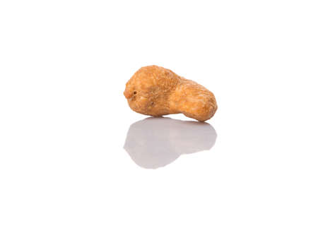 Roasted and salted cashew nut over white backgroundの写真素材